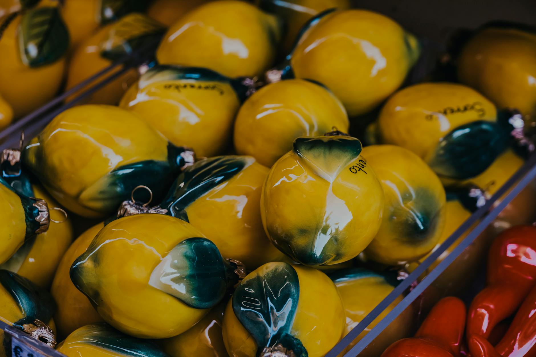 Vibrant yellow ceramic lemons artfully displayed, symbolizing the lemon vibrator experience